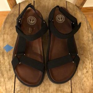 Black and brown leather sandals with nylon straps